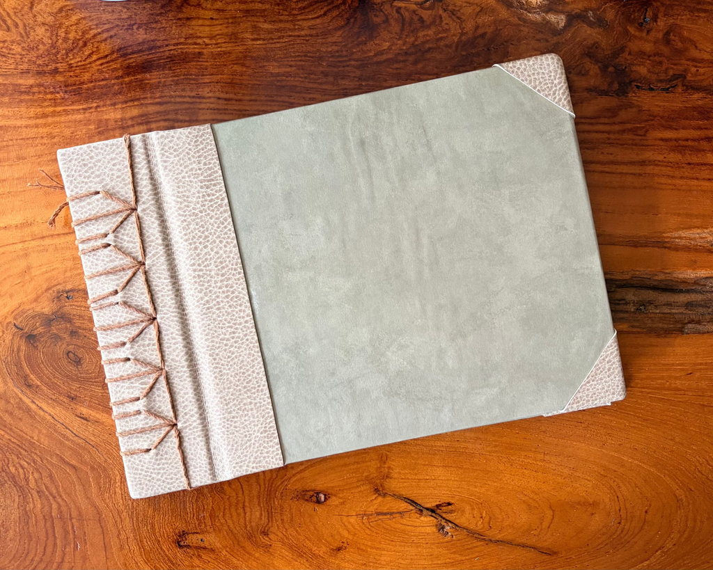Book with textured cover on a wooden surface