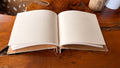 Open notebook on a wooden surface